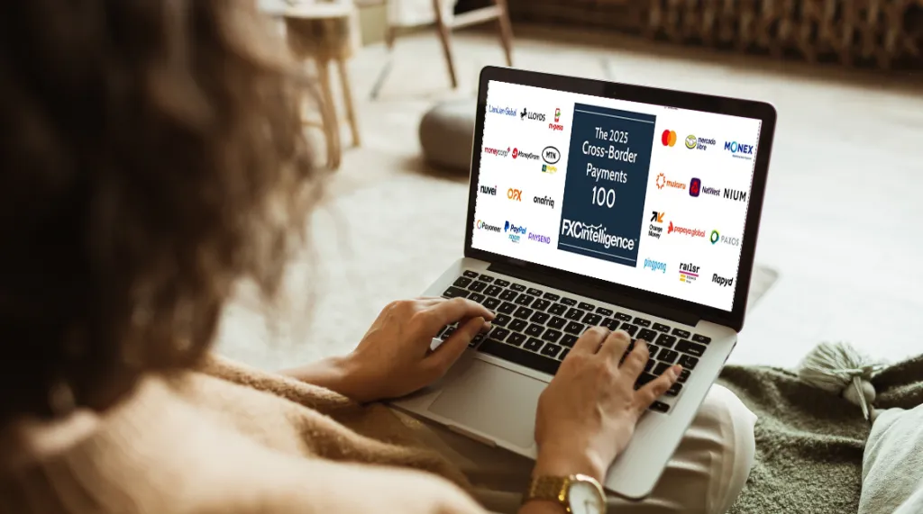 An image of a woman on a laptop displaying the FXC Intelligence 2025 Cross-Border Payments 100 market map