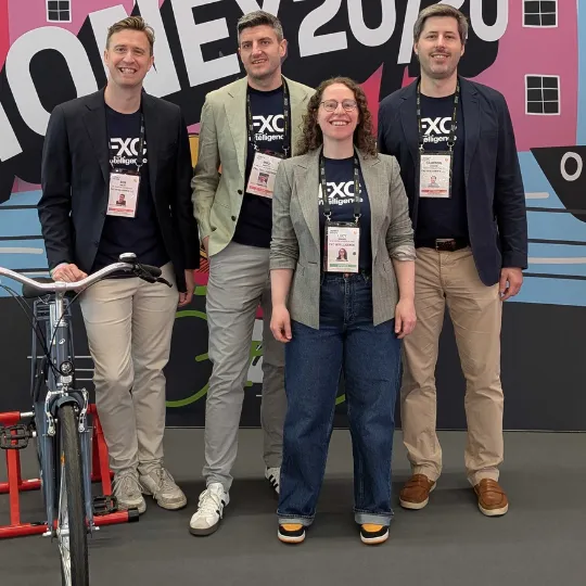 A picture of four FXC Intelligence employees at Money20/20