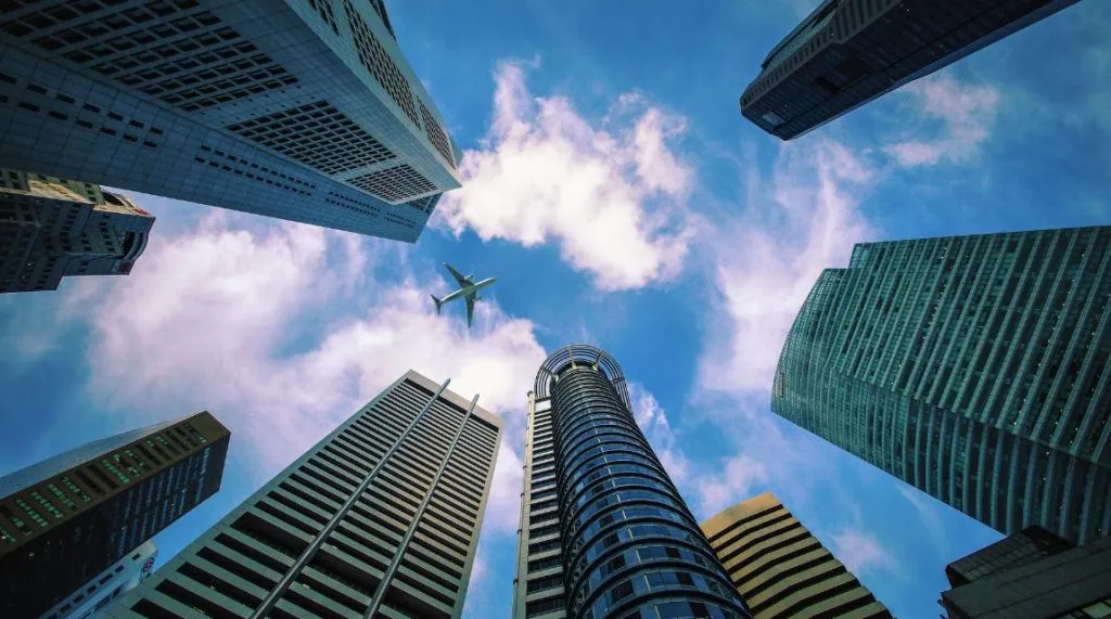 A photo looking up at the sky with various banking skyscrapers in view